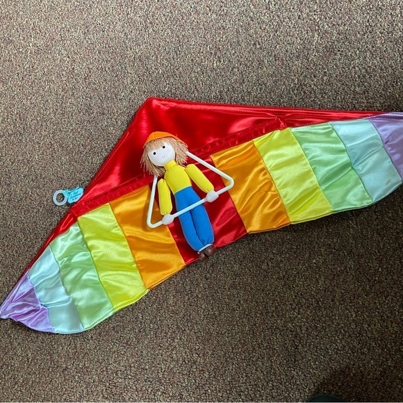 Russ Other - ADORABLE, hang gliding soft sculpture features a child hanging on a breeze.